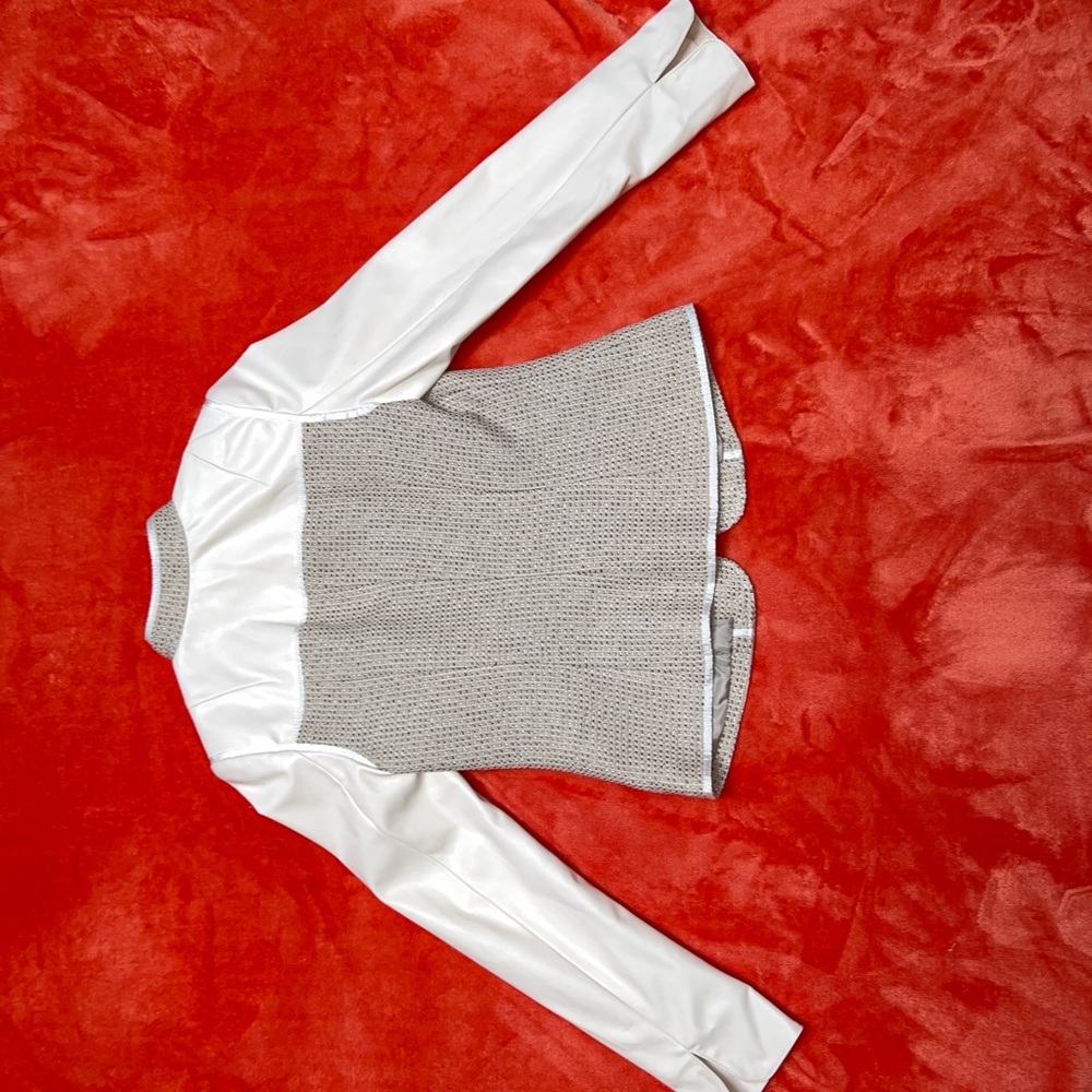 Calvin Klein women’s tweed jacket with faux leather sleeves and Mandarin collar.